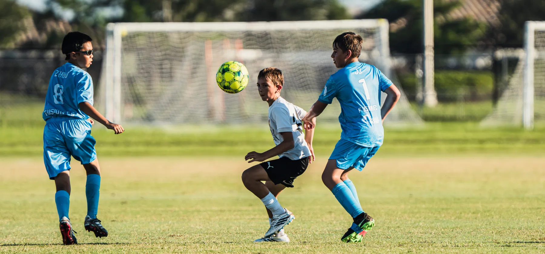 Boys playing soccer at a Florida Easter Cup field